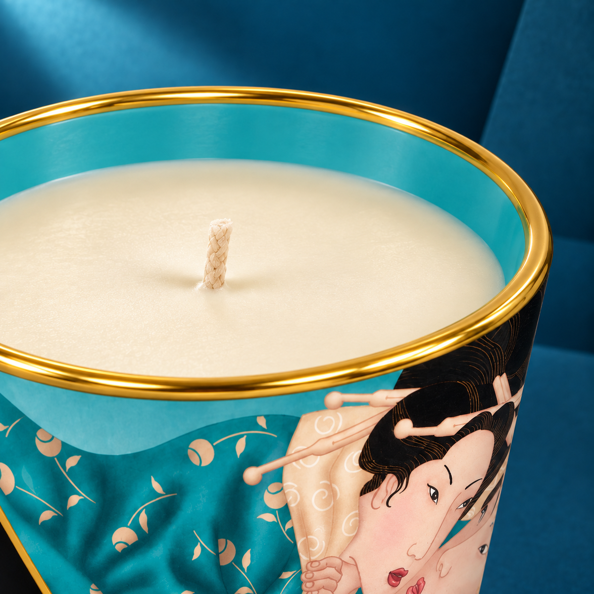 Shunga Island Blossoms massage candle, wax and gold rim detail