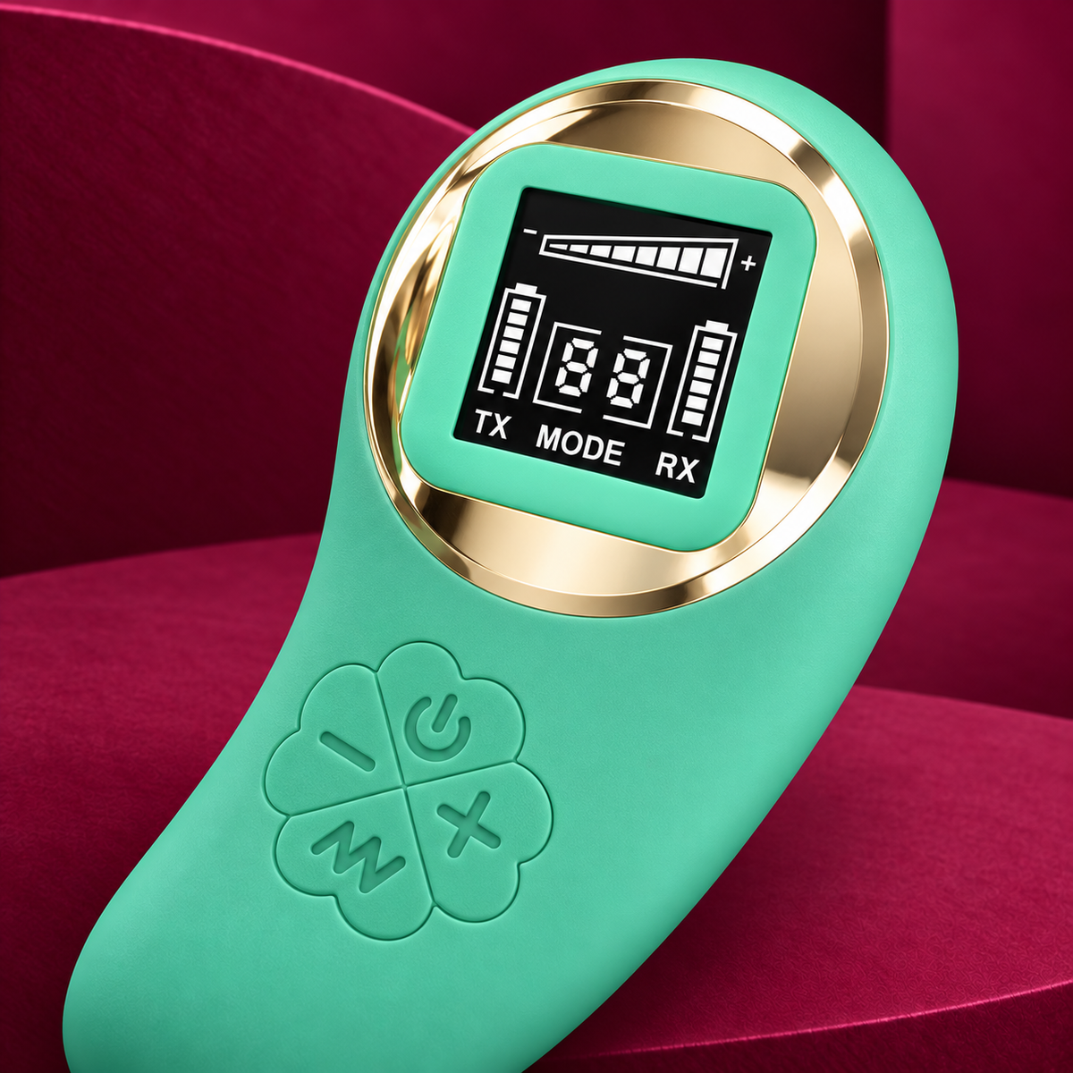 Pretty Love Green remote LCD and four-button detail on red geometric background