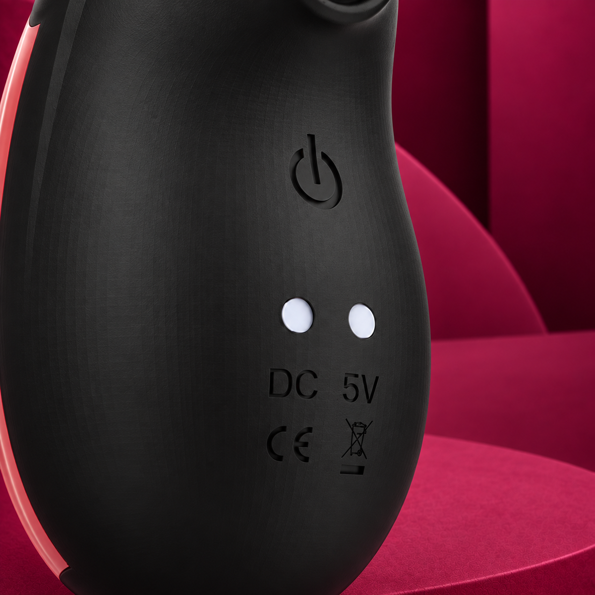 Rithual Shushu 2.0 Black rear power and charging detail on red geometric background