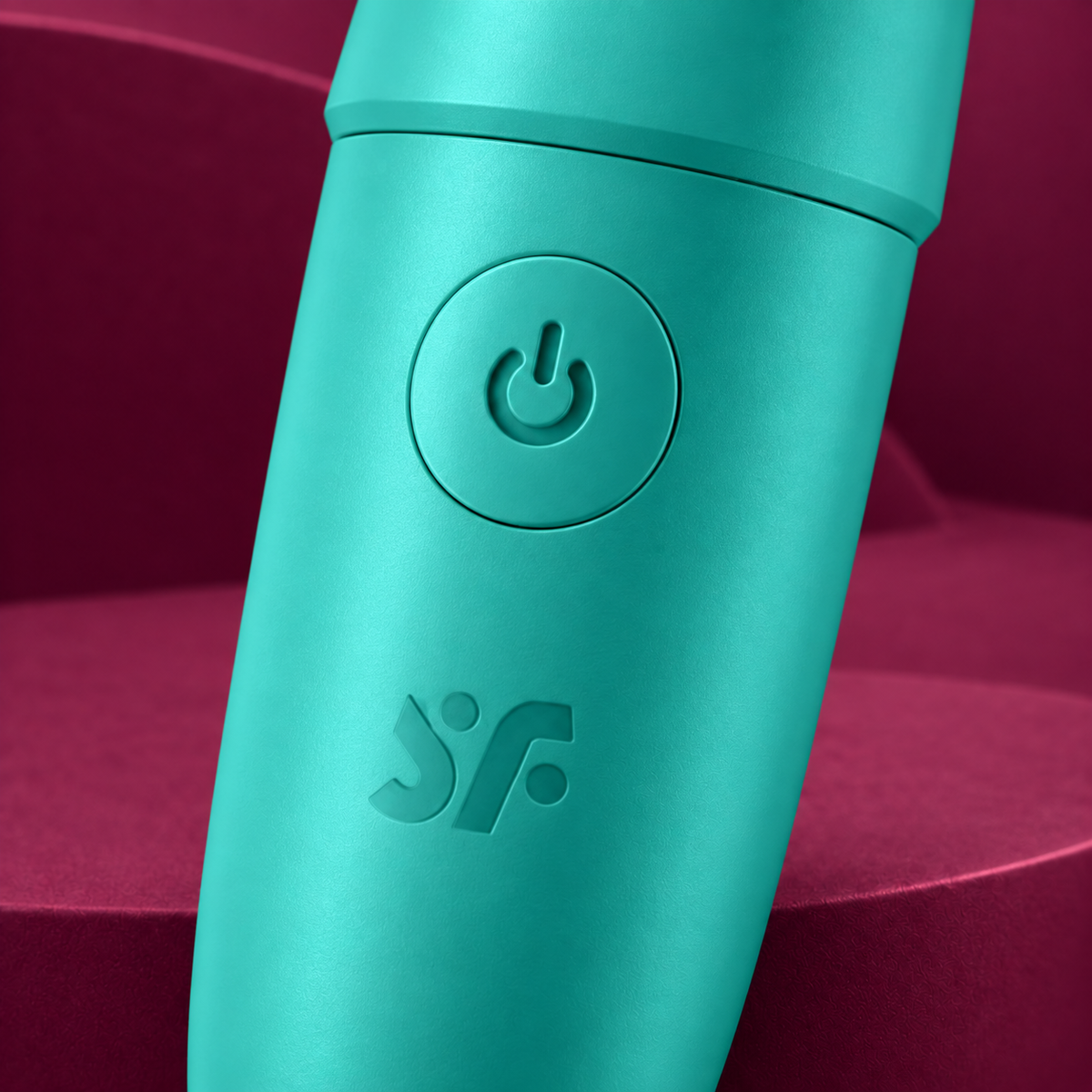 Satisfyer Ultra Power Bullet 6 turquoise control detail on red geometric background